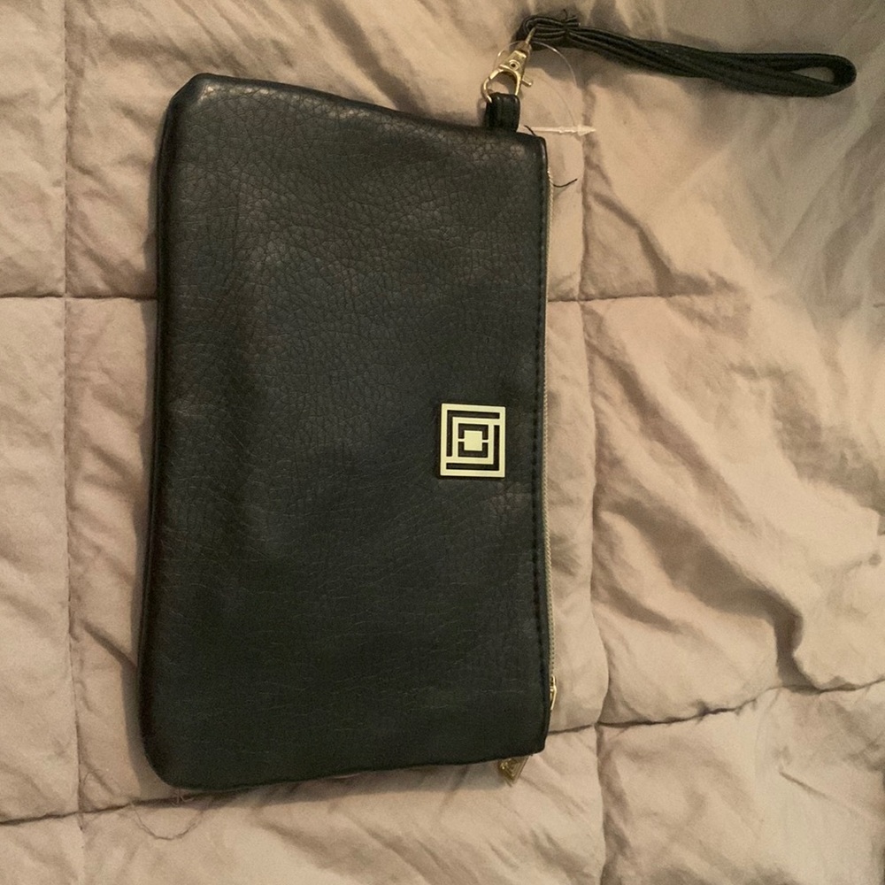 Liz Claiborne wrist pocket book with built in charger ports.